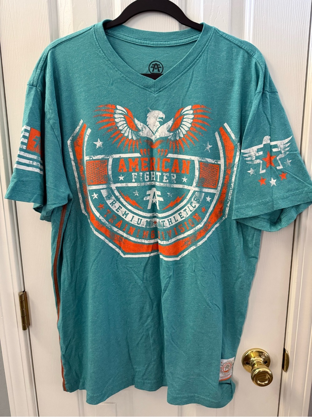 American Fighter Teal Short Sleeve Tee with Orange & White Graphic